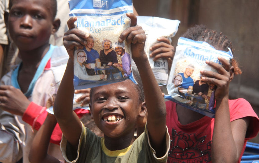 kids holding FMSC food bags