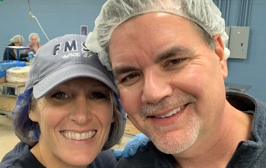 FMSC CEO JJ Slag and his wife packing meals