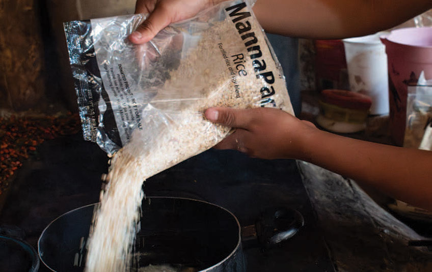 MannaPack Rice being poured into a pot