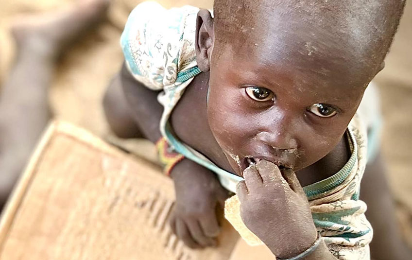 A child eating FMSC food