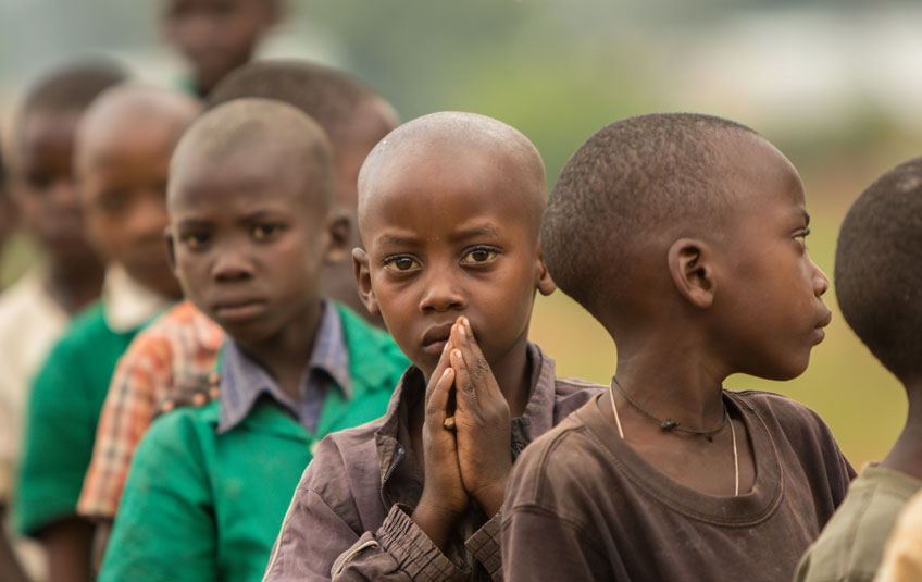 Ugandan children standing in line