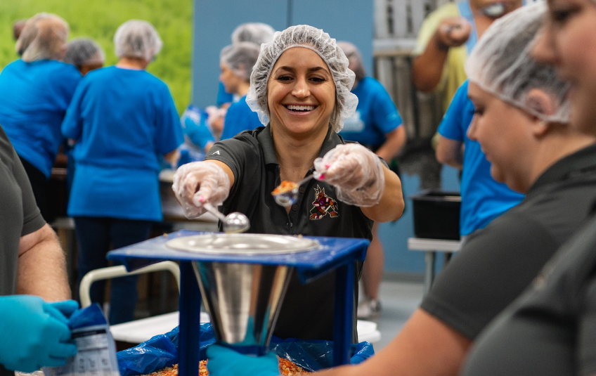 Volunteer packing meals at FMSC 